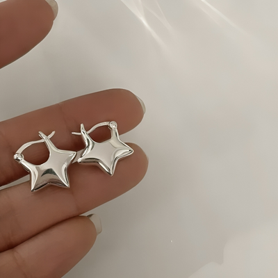 Astrielle - Stervormige zirkonia oorbellen met kruisdetail