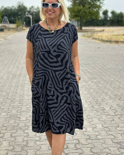 Nelia - Zomerjurk met ronde hals en mooie print