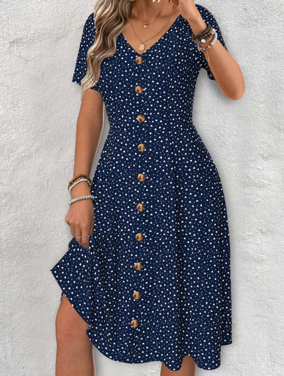 Navy blue dress with short sleeves, V-neck, and polka dot pattern
