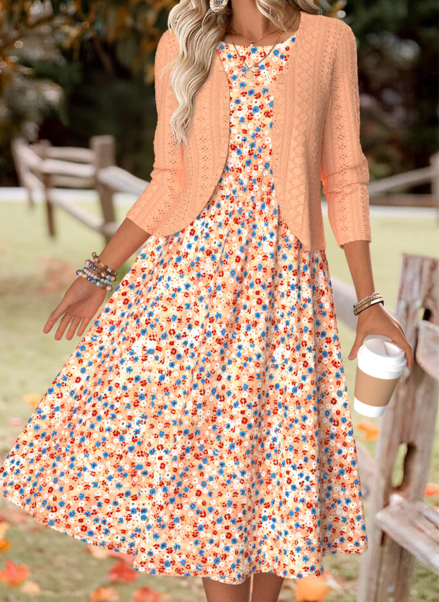 Oranje jurk met bloemenprint en lange mouwen en vestje