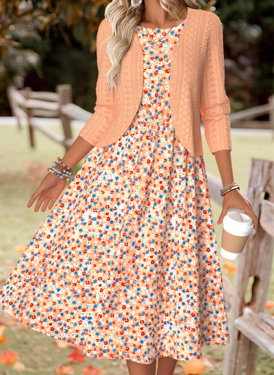 Oranje jurk met bloemenprint en lange mouwen en vestje