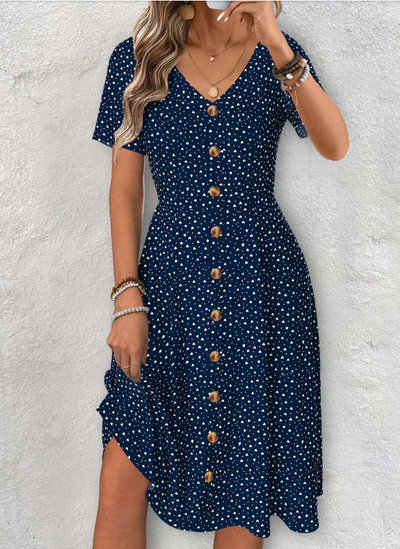 Navy blue dress with short sleeves, V-neck, and polka dot pattern